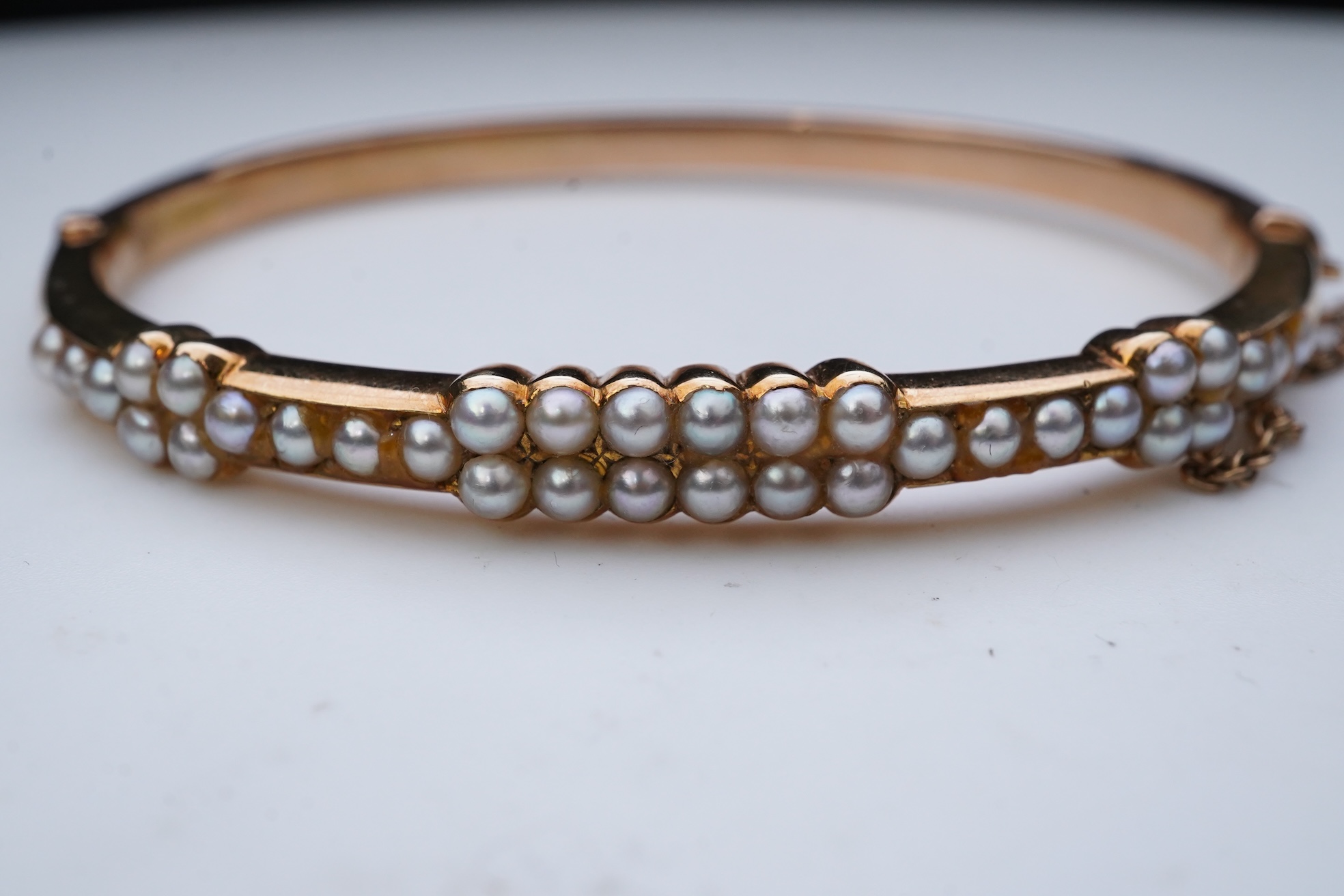 An Edwardian seed pearl bangle, early 20th century